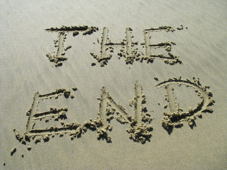 The End writing on the beach